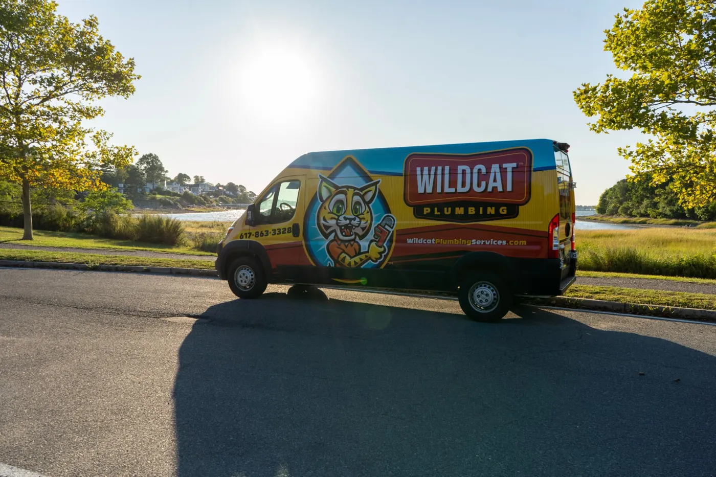 Wildcat Plumbing van on a waterfront road in Braintree, MA